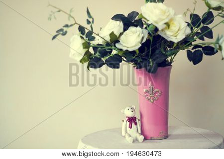 Rose placed on the desk in blue background