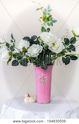 Rose placed on the desk in blue background
