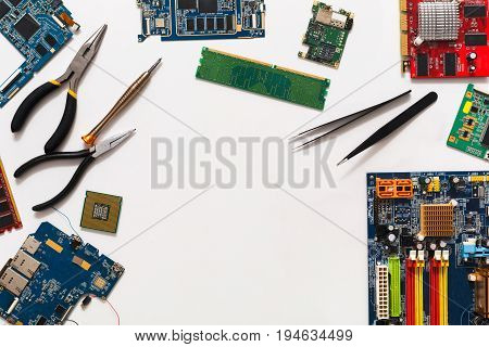 Computer repair and upgrade background, copy space. Motherboard top view, flat lay. Technology maintenance, electronics repair shop concept