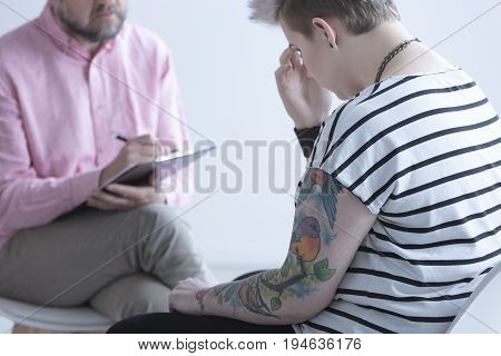 Young girl sharing her feelings with a therapist