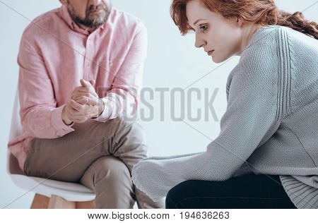 Apathetic girl having an individual therapy with counselor