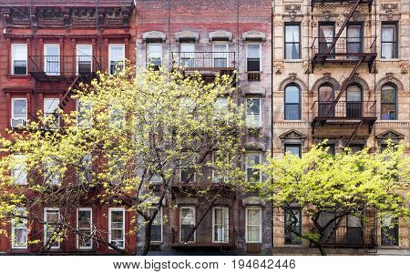 Historic old buildings and trees along 3rd Avenue in the East Village of Manhattan New York City NYC