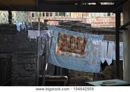 Old courtyard with clothes on clothesline in Odessa.