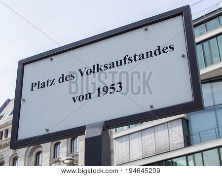BERLIN GERMANY - JULY 9 2017: Street Sign Platz des Volksaufstandes von 1953 Meaning Place of The Popular Uprising of 1953 In German Language Berlin