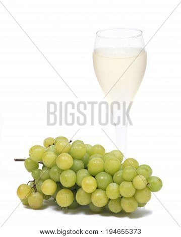 Glass of white wine and ripe organic green grapes isolated on white background