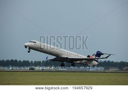 Amsterdam the Netherlands - July 6th 2017: OY-KFE SAS Scandinavian Airlines Canadair CRJ-900 takeoff from Polderbaan runway Amsterdam Schiphol Airport
