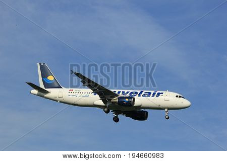 Amsterdam the Netherlands - July 7th 2017: TS-INQ Nouvelair Tunisie Airbus A320 approaching Schiphol Amsterdam Airport Polderbaan runway