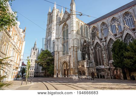 Street view with saint Bavo cathedral during the morning light in Gent city, Belgium