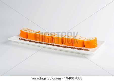Dessert Maki Sushi - Roll With Various Fruit In Rice Pudding And Coconut Flakes