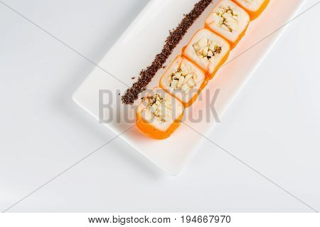 Dessert Maki Sushi - Roll With Various Fruit In Rice Pudding And Coconut Flakes