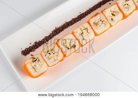 Dessert Maki Sushi - Roll With Various Fruit In Rice Pudding And Coconut Flakes