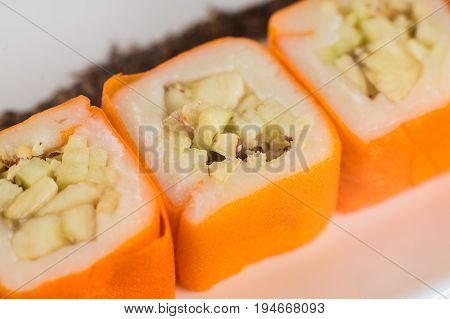 Dessert Maki Sushi - Roll With Various Fruit In Rice Pudding And Coconut Flakes