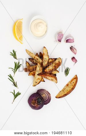 Baked Potatoes With Rosemary And Garlic, Served With Aioli Sauce On A White Background..