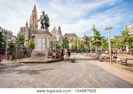 ANTWERPEN, BELGIUM - June 02, 2017: View on the crowded Green square with Rubens statue and church in Antwerpen city, Belgium