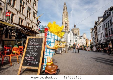 ANTWERPEN, BELGIUM - June 02, 2017: Street view with crowded cafes and fast foods at the center of the old town of Antwerpen city in Belgium