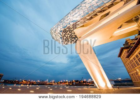 ANTWERPEN, BELGIUM - June 02, 2017: Night view on the illuminated Port House building designed by Zaha Hadid architect in 2009 in Antwerpen city, Belgium