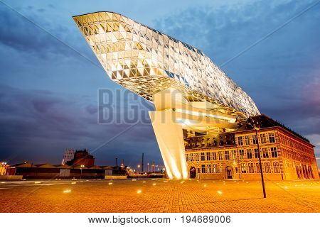 ANTWERPEN, BELGIUM - June 02, 2017: Night view on the illuminated Port House building designed by Zaha Hadid architect in 2009 in Antwerpen city, Belgium