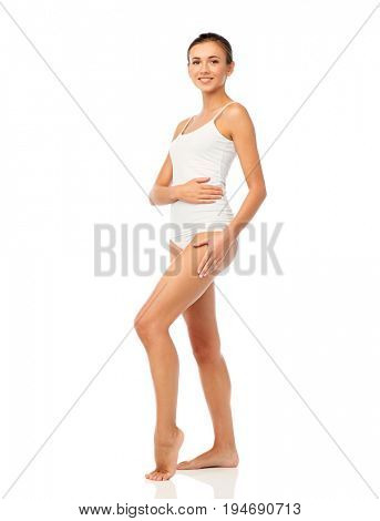 beauty, people, anticellulite and bodycare concept - beautiful young woman in white underwear