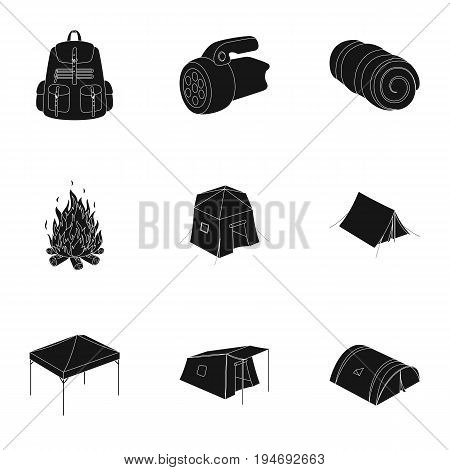 Various kinds of tents and other tourist accessories. The tent set collection icons in black style vector symbol stock illustration .