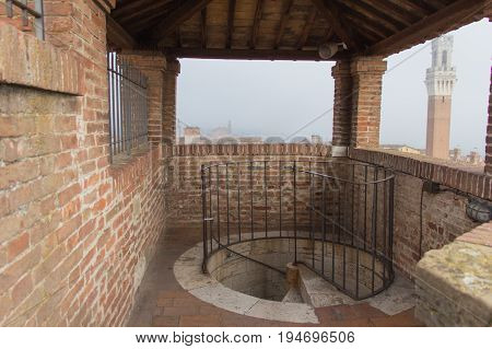 The view of spiral staircase down from the Facciatone Siena Tuscany. Italy.