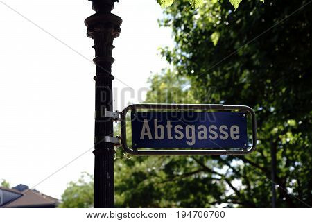 A nostalgic street sign Abbot Street in Mainz on a striking lantern.