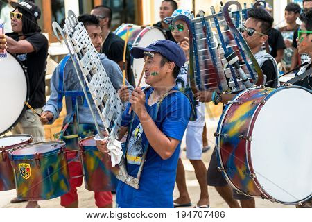 BORACAY, WESTERN VISAYAS, PHILIPPINES - JANUARY 11, 2015: Filipino band playing music for the Ati-Atihan Festival at White Beach.