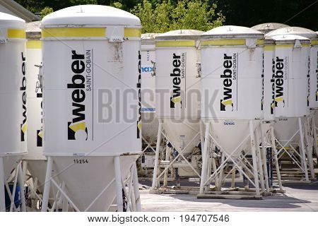 MAINZ, GERMANY - JUNE 10: Building material silos from the company Weber on the industrial site of Heidelberg cement on June 10 2017 in Mainz.