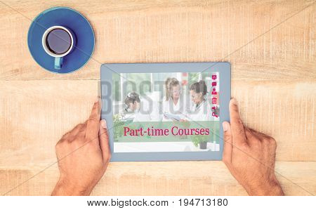Composite image of part-time courses against hand holding on digital tablet over table by coffee