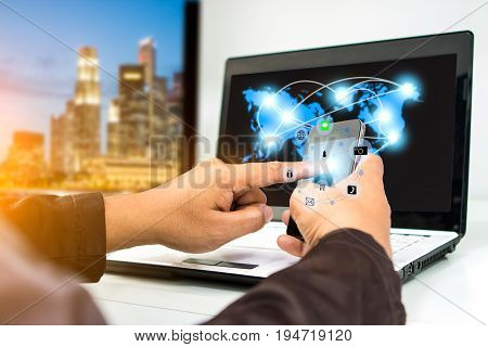 businessman using smartphone upload data to online store Documentation over blurred Distributed threat information to clients for customer network connection .digital technology.select focus