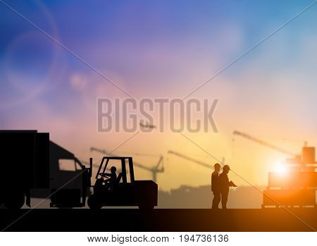 Silhouette of high voltage equipment engineer check before boarding a shuttle to dock to construction site over blurred pastel background sunset shipping. Heavy industry and Transportation concept.