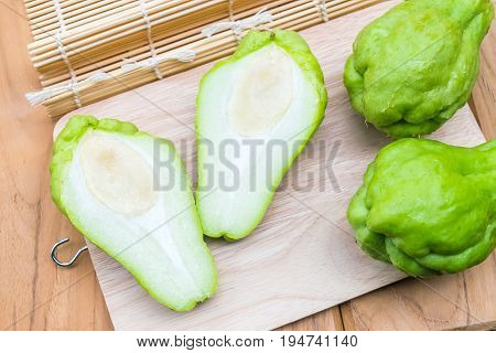 Fresh Chayote fruit on wooden table background