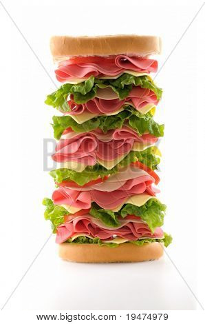 Healthy and big ham sandwich with lettuce, tomato and cheese isolated on white background.