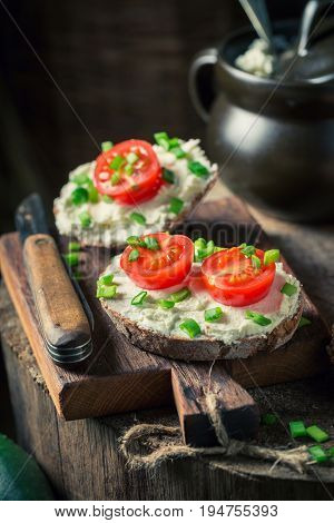 Closeup Of Sandwich With Fromage Cheese, Chive And Cherry Tomatoes