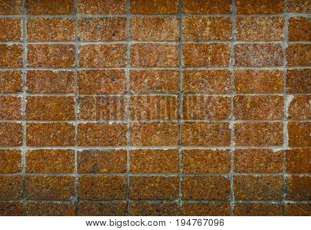 Front view of old grunge laterite wall texture.