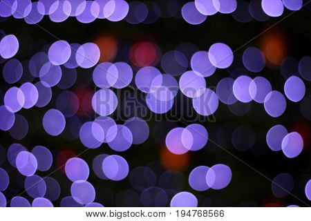 Defocused abstract christmas tree light bokeh for use as background.