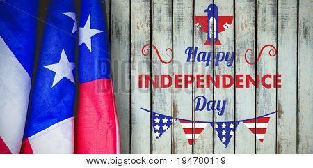 Digitally generated image of Happy independence day text with decoration  against wood background