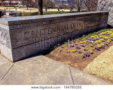 ATLANTA GA USA MARCH 5 2014 - Sign on marble plate at entrance to Centennial Olympic Park on March 5 2014 in Atlanta GA USA. It was built for the Centennial 1996 Summer Olympics.