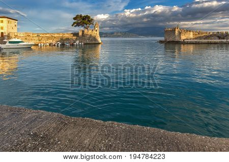 NAFPAKTOS, GREECE - MAY 28, 2015: Sunset panorama of Fortification at the port of Nafpaktos town, Western Greece