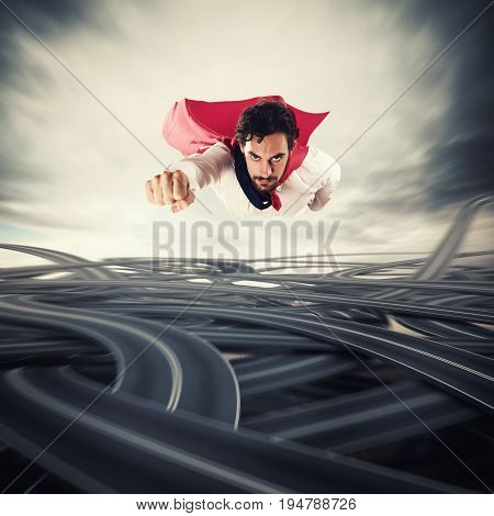 Male superhero with read cloak flying fast over road junctions. Concept of success and breakthrough