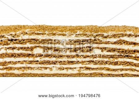 Honey cake texture on white background. Honey shortcakes sour cream with walnuts and prunes