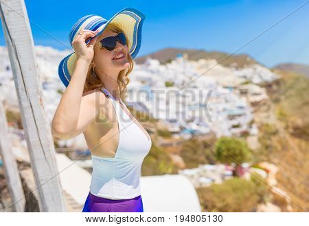 Sexy woman looking at the sun and smiling