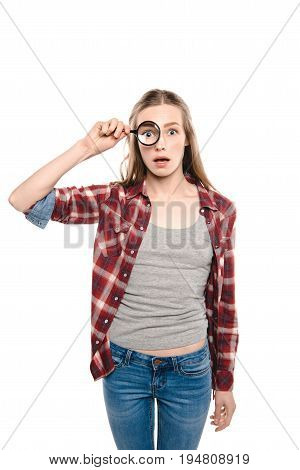Shocked Young Woman Looking Throungh Magnifier Isolated On White