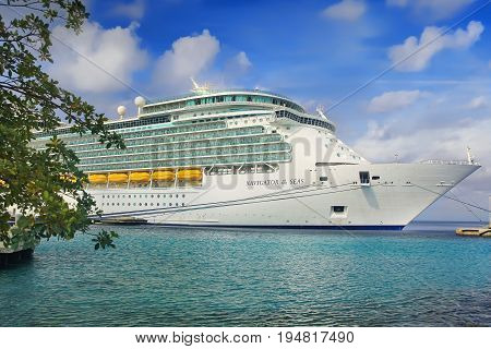 KRALENDIJK, BONAIRE, NETHERLAND - APRIL 20, 2017: Royal Caribbean cruise ship Navigator of the Seas docked at the port of Kralendijk, Bonaire