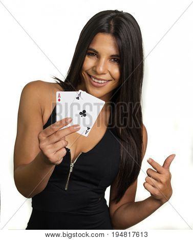 Happy smiling woman holding aces winning hand
