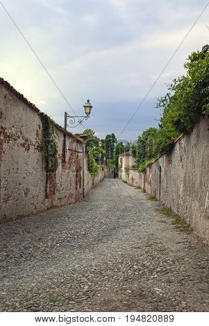 Narrow stone road between the city walls of Saluzzo, northern Italy