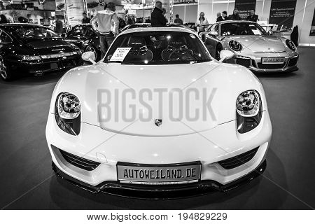 STUTTGART GERMANY - MARCH 17 2016: Mid-engined plug-in hybrid sports car Porsche 918 Spyder 2015. Black and white. Europe's greatest classic car exhibition "RETRO CLASSICS"