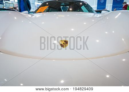 STUTTGART GERMANY - MARCH 17 2016: Fragment of a mid-engined plug-in hybrid sports car Porsche 918 Spyder 2015. Europe's greatest classic car exhibition 