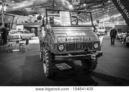 STUTTGART GERMANY - MARCH 18 2016: Multi-purpose auto four-wheel drive medium truck produced by Mercedes-Benz Unimog U25 1956. Black and white. Europe's greatest classic car exhibition 
