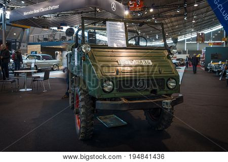STUTTGART GERMANY - MARCH 18 2016: Multi-purpose auto four-wheel drive medium truck produced by Mercedes-Benz Unimog U25 1956. Europe's greatest classic car exhibition 