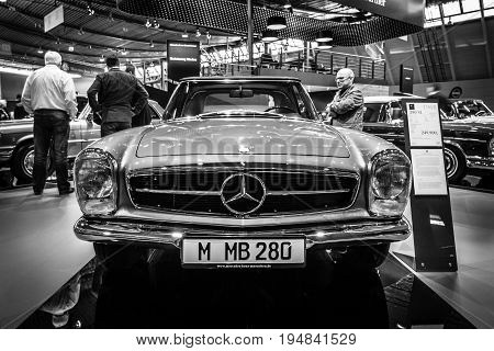 STUTTGART GERMANY - MARCH 18 2016: Sports car Mercedes-Benz 280 SL (W113) 1968. Black and white. Europe's greatest classic car exhibition 